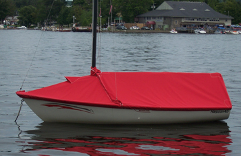 Mooring Cover installed on a sailboat with mast up and boom in place, showing the pitched shape for water runoff